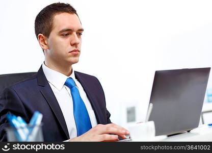 Young manager working with notebook in the office