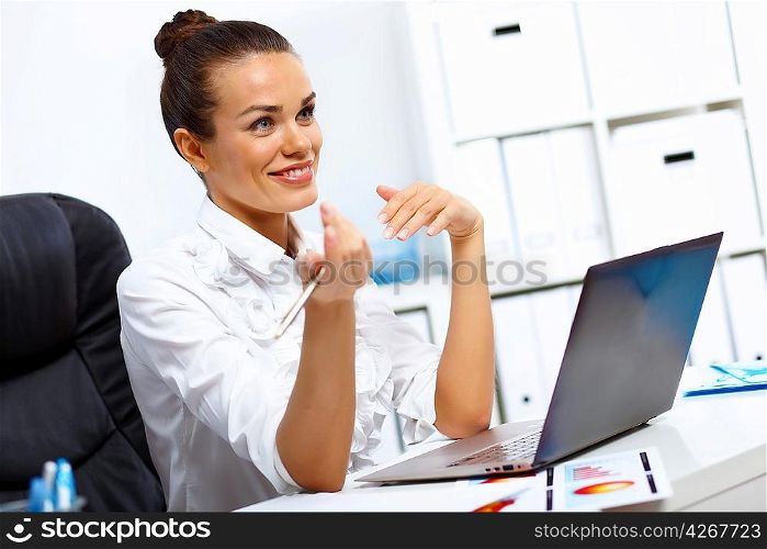 Young manager working with notebook in the office