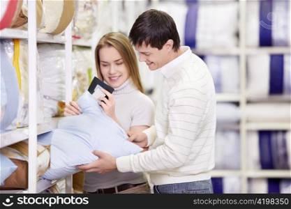Young married couple shopping in a store