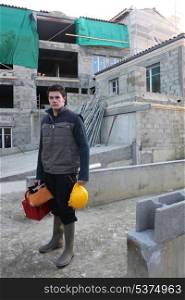 young mason on a construction site