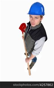 Young mason with shovel