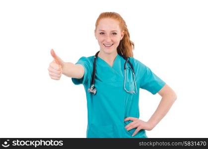 Young medical trainee with stethoscope thumbing up isolated on white