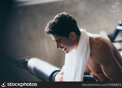 Young men are relaxed from exercise in the gym Along with towels