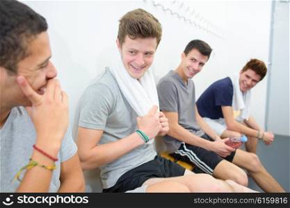 young men having a laugh in the locker room
