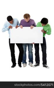 Young men holding up a blank sign