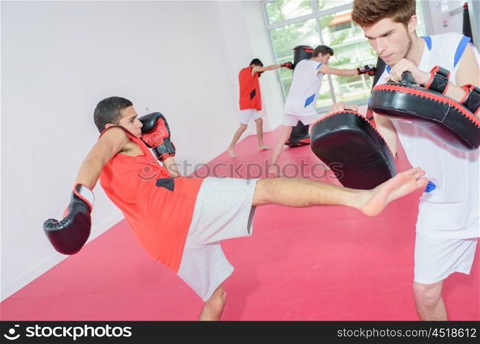 Young men in kick boxing class