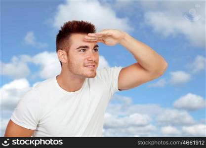 Young men looking at side with a blue sky of background