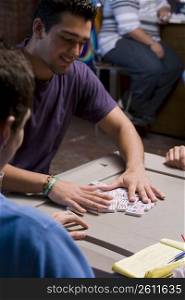 Young men playing dominos