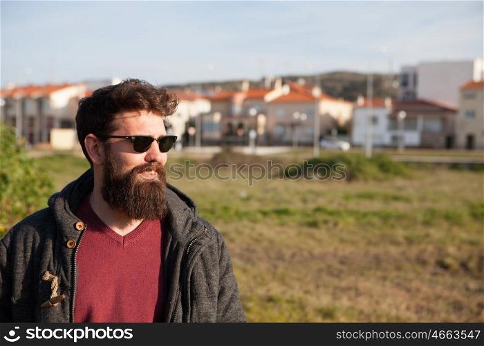 Young men with hipster look sunbathing winter