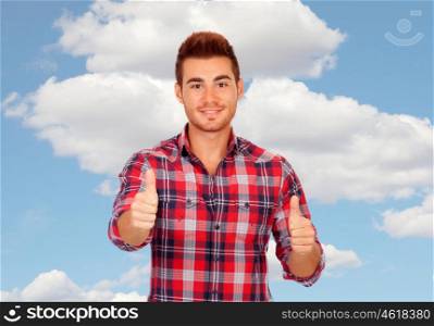 Young men with plaid shirt saying Ok isolated on a white background
