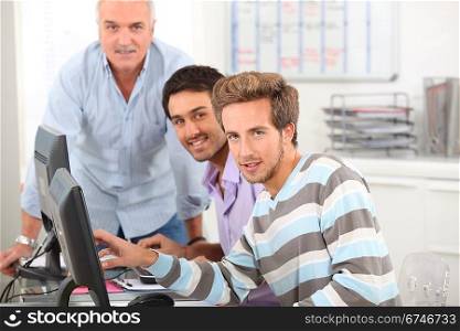 Young men working at their computers