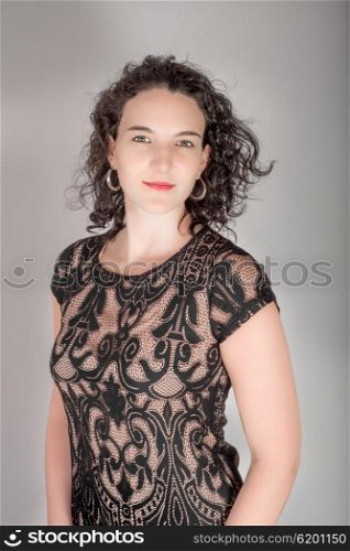 Young model in her mid twenties in a black dress.