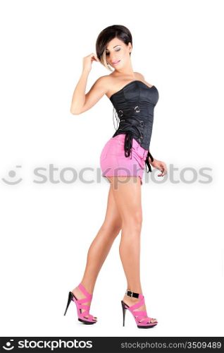young model in pink mini skirt and black corset posing, isolated on white