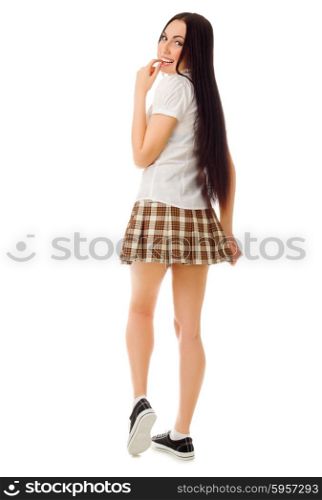 Young modest girl in plaid skirt isolated