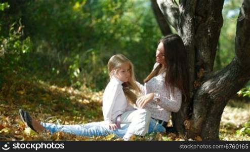 Young mother and daughter having a great day in the park