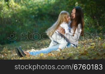 Young mother and daughter having a great day in the park