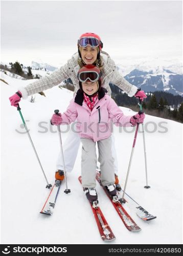 Young Mother And Daughter On Ski Vacation