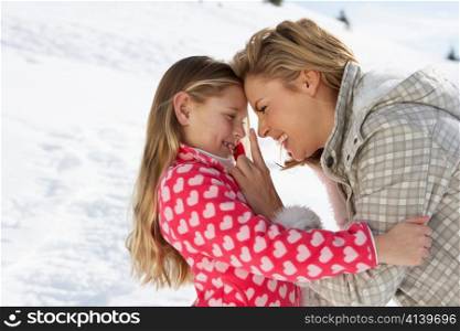 Young Mother And Daughter On Winter Vacation