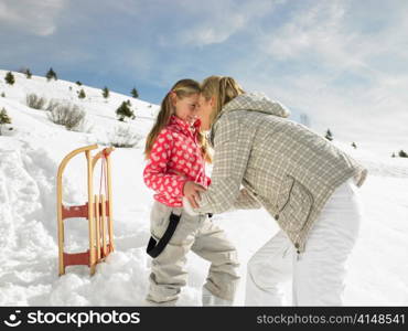 Young Mother And Daughter On Winter Vacation