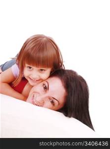Young Mother and daugther embracing on bed