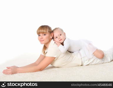 young mother and her little daughter doing sport together indoors