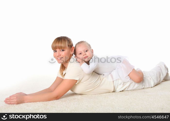 young mother and her little daughter doing sport together indoors