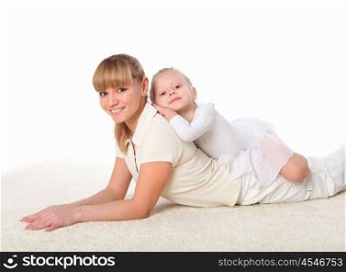 young mother and her little daughter doing sport together indoors