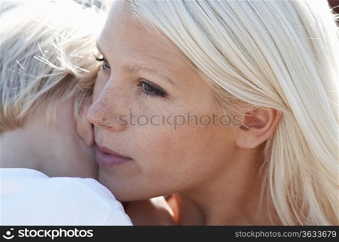 Young mother and son (3-4), close-up, focus on mother&acute;s face