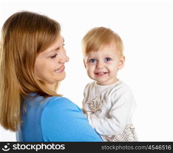 young mother having fun with her little son on the floor