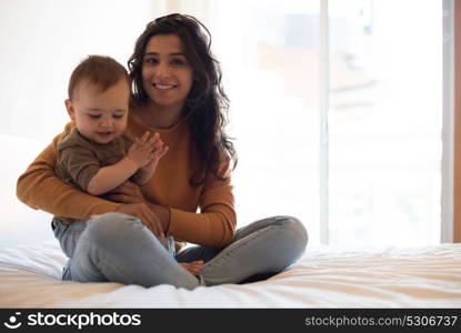 Young Mother spending time with her little baby