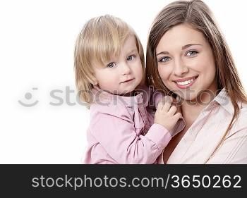 Young mother with her daughter in her arms on a white background