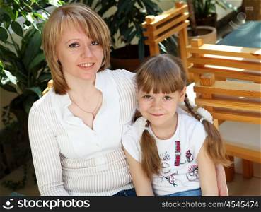 young mother with her little daughter together