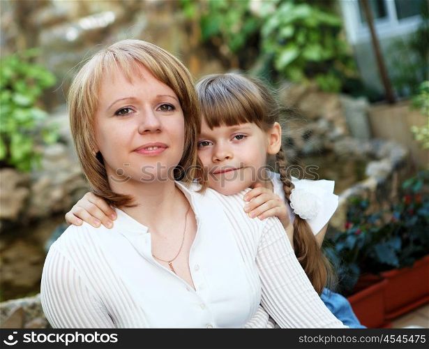 young mother with her little daughter together