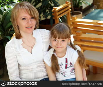 young mother with her little daughter together