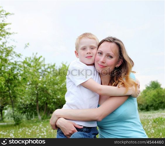 young mother with her son outdoors relaxing