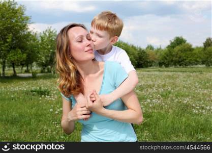young mother with her son outdoors relaxing