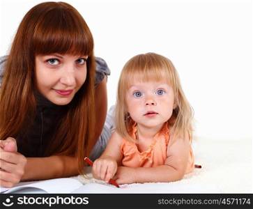 Young mother with little daughter in studio
