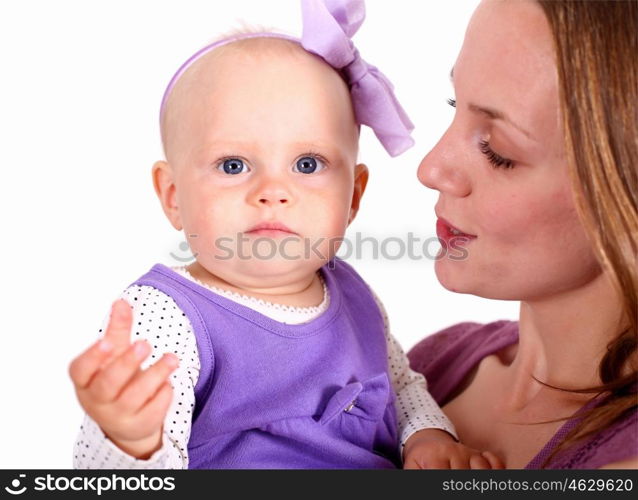 Young mother with little daughter in studio