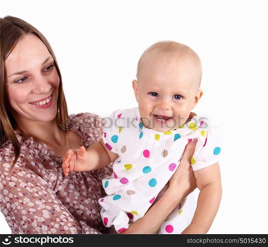 Young mother with little daughter in studio