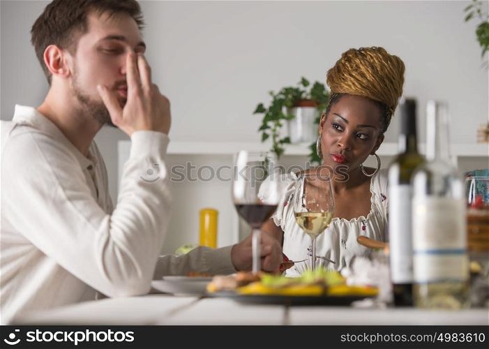 Young Multiracial Couple Enjoying Meal at Home