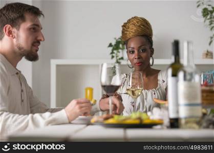 Young Multiracial Couple Enjoying Meal at Home