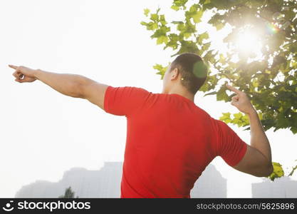 Young Muscular Man Stretching