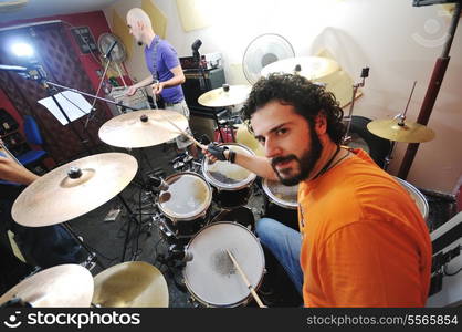 young music player and band friends have training in home garage