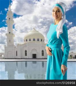 Young muslim girl on mosque background