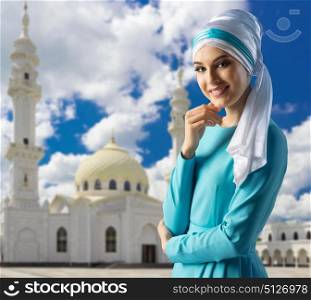 Young muslim girl on mosque background