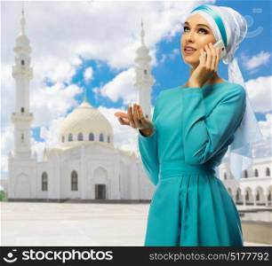 Young muslim girl on white mosque background