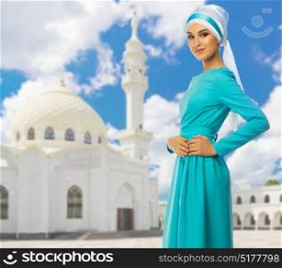 Young muslim girl on white mosque background