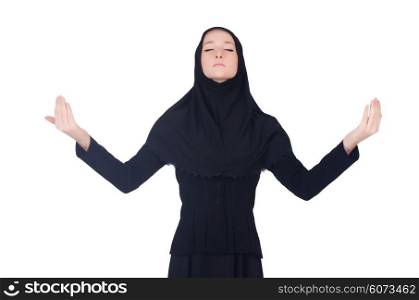 Young muslim woman praying isolated on white