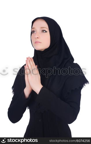 Young muslim woman praying isolated on white