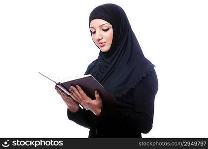 Young muslim woman with book on white